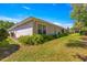 Backyard showing a glimpse of the property's landscaping along the side of the home at 11058 Sw 69Th Cir, Ocala, FL 34476