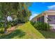 Well maintained backyard with mature trees and landscaping, providing ample shade and privacy at 11058 Sw 69Th Cir, Ocala, FL 34476