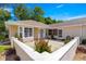 Charming property with a well kept patio, garden, and a brick wall surrounding the area at 11058 Sw 69Th Cir, Ocala, FL 34476