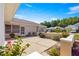 A view of the backyard's patio, with an open sky, manicured hedges and shrubs surrounding at 11058 Sw 69Th Cir, Ocala, FL 34476
