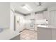 Bright kitchen with white appliances, tile flooring, and ample cabinet space for storage at 11058 Sw 69Th Cir, Ocala, FL 34476