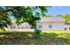 Exterior view of the home's back featuring a screened in porch at 11591 Sw 78Th Ave, Ocala, FL 34476