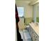 Functional bathroom with a large countertop, under sink cabinets, and window at 11591 Sw 78Th Ave, Ocala, FL 34476