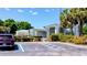 Charming community clubhouse exterior with accessible parking, beautiful landscaping, and a welcoming entrance at 11591 Sw 78Th Ave, Ocala, FL 34476
