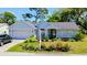 Charming single-story home with a well-manicured lawn, fresh landscaping, and attached garage at 11591 Sw 78Th Ave, Ocala, FL 34476