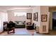 A living area with hardwood floors, neutral walls, a horizontal window and decor at 11591 Sw 78Th Ave, Ocala, FL 34476