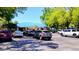 Parking lot and blue roofed building surrounded by trees at 11591 Sw 78Th Ave, Ocala, FL 34476