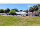 Community clubhouse with a fenced-in pool area and lounge chairs at 11591 Sw 78Th Ave, Ocala, FL 34476
