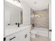 Contemporary bathroom with white vanity, quartz countertop, and a tiled shower-tub combo at 12 Bahia Pass Ter, Ocala, FL 34472