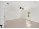 Bright, minimalist bedroom with tile floors, ceiling fan, and ample natural light at 12 Bahia Pass Ter, Ocala, FL 34472