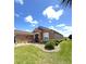 Single-story home with a well-manicured lawn and attractive landscaping at 13111 Se 86Th Cir, Summerfield, FL 34491
