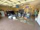 Spacious garage converted to a recreational space with sitting area at 13111 Se 86Th Cir, Summerfield, FL 34491