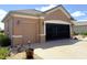 Garage and screened-in porch with a concrete driveway and well-maintained exterior at 13111 Se 86Th Cir, Summerfield, FL 34491