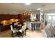 Spacious kitchen with dark wood cabinets, stainless appliances, tile flooring, and breakfast bar seating at 13111 Se 86Th Cir, Summerfield, FL 34491