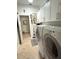 Laundry room featuring a front-loading washer and dryer at 13111 Se 86Th Cir, Summerfield, FL 34491