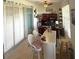 Bright office area with a built-in desk, shelving, bar, and cozy seating at 13111 Se 86Th Cir, Summerfield, FL 34491