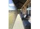 Screened-in patio with comfortable seating, perfect for enjoying the outdoors at 13111 Se 86Th Cir, Summerfield, FL 34491