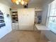 Neutral room featuring built in cabinets, Murphy bed, work space, and tile floors at 13111 Se 86Th Cir, Summerfield, FL 34491