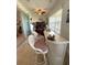 Bright sunroom area featuring a unique bar with seating, sliding glass doors, and tiled floors at 13111 Se 86Th Cir, Summerfield, FL 34491