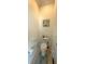 Powder room featuring a toilet, neutral paint, with a decorative floral wall print at 13111 Se 86Th Cir, Summerfield, FL 34491
