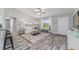 Inviting living room featuring stylish decor, natural light, and an open layout connected to the kitchen area at 13185 Sw 83Rd Terrace Rd, Ocala, FL 34473