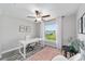 Office area with a ceiling fan, a large window view, and neutral decor at 13185 Sw 83Rd Terrace Rd, Ocala, FL 34473