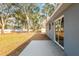 The backyard features a patio and mature trees, offering shade at 13300 Sw 105Th Pl, Dunnellon, FL 34432