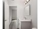 Well-lit bathroom featuring modern vanity, stylish sink, and updated lighting fixtures at 13300 Sw 105Th Pl, Dunnellon, FL 34432