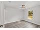 Light-filled bedroom with a ceiling fan and a window offering a pleasant outdoor view at 13300 Sw 105Th Pl, Dunnellon, FL 34432