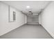 Clean and spacious garage featuring a new garage door and epoxy painted floor at 13300 Sw 105Th Pl, Dunnellon, FL 34432