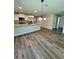 Bright open-concept kitchen featuring a large island and stainless steel appliances at 13518 Sw 114Th Ln, Dunnellon, FL 34432