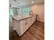 Stylish kitchen island with granite countertops, a sink and storage at 13518 Sw 114Th Ln, Dunnellon, FL 34432
