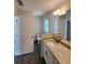 Bathroom featuring a decorative countertop, large mirror, and white cabinets, plus a toilet at 1475 Sw Big Bear Rdg, Dunnellon, FL 34431