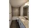 Bathroom features a shower-tub combo with decorative tile and a granite countertop vanity at 1475 Sw Big Bear Rdg, Dunnellon, FL 34431