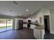 Modern kitchen with stainless steel appliances, granite countertops, and a view to the dining room at 1475 Sw Big Bear Rdg, Dunnellon, FL 34431