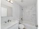 Bathroom boasts quartz counters, large mirror, and a decorative tiled shower over tub at 15067 Sw 16 Pl, Ocala, FL 34481