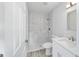 Bathroom featuring tiled shower, modern vanity, and updated fixtures at 15067 Sw 16 Pl, Ocala, FL 34481