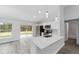 Open concept kitchen with stainless appliances, eat-in bar and easy access to backyard at 15071 Sw 16 Pl, Ocala, FL 34481