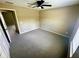 Neutral bedroom with gray carpet, ceiling fan, and bright natural light at 15585 Sw 46Th Cir, Ocala, FL 34473