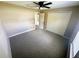 Bedroom featuring neutral walls, carpet, ceiling fan, window, and closet at 15585 Sw 46Th Cir, Ocala, FL 34473