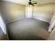 Large carpeted bedroom with a ceiling fan and lots of space at 15585 Sw 46Th Cir, Ocala, FL 34473