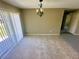 Bright dining room with tiled floor, sliding glass doors and an elegant chandelier at 15585 Sw 46Th Cir, Ocala, FL 34473