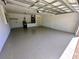 Spacious garage featuring painted walls, sealed floor and hot water tank at 15585 Sw 46Th Cir, Ocala, FL 34473