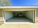 Spacious two car garage featuring freshly painted walls and a sealed floor at 15585 Sw 46Th Cir, Ocala, FL 34473