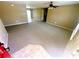 Open-concept living room featuring neutral carpet and tile flooring, seamlessly transitioning to the dining area at 15585 Sw 46Th Cir, Ocala, FL 34473