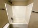 Bright shower with tile surround, matte black hardware, and built-in shelf at 15585 Sw 46Th Cir, Ocala, FL 34473