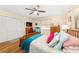 Bedroom offering comfort and storage with a ceiling fan and closet, creating a serene haven at 16405 Se 90Th Ct, Summerfield, FL 34491