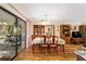 An open concept dining room with an adjacent outdoor area, creating an inviting space for gatherings at 16405 Se 90Th Ct, Summerfield, FL 34491