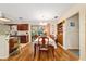 Bright dining room with hardwood floors, patio access, and ample natural light at 16405 Se 90Th Ct, Summerfield, FL 34491