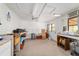 Another interior shot of the shed showcases more of the workspace and utilities at 16405 Se 90Th Ct, Summerfield, FL 34491